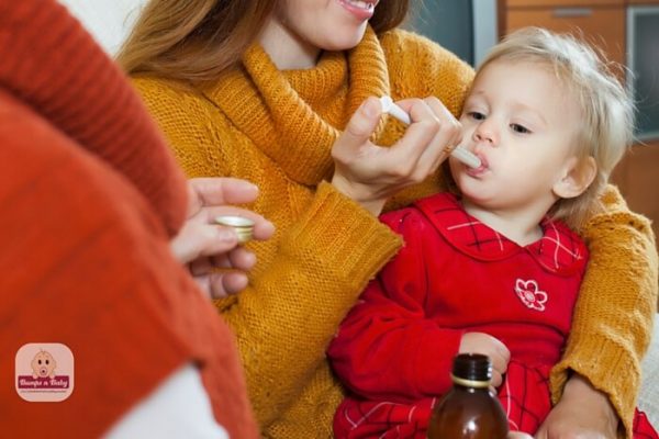 Fever in children-giving medicine